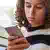 Teenage girl looking at her phone