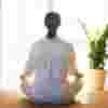 Woman sitting on the floor meditating