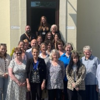 A group photo outside the visitor's centre of Spurgeons Invisible Walls Volunteers, who are being honoured for their work in Prison Family Support. 