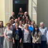 A group photo outside the visitor's centre of Spurgeons Invisible Walls Volunteers, who are being honoured for their work in Prison Family Support.