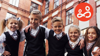 Children together demonstrating a successful transition to secondary school successfully.