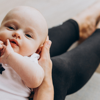 A mother holds her baby.