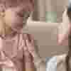 Mother with her hand on her daughter's shoulder