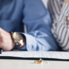 Two parents attend a divorce mediation meeting