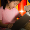 Child reading to toys as part of her bedtime routine