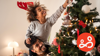 Father and child decorating the Christmas tree