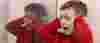 Autistic boy covering his ears and shouting