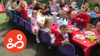 A group photo of children at Buttons pre-school celebrating the coronation of King Charles, at an afternoon tea event
