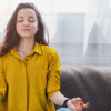 Woman meditating at home