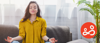 Woman meditating at home