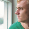 A former prison father looking out of a window.