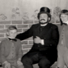 An old photograph of Peter, Robert and Colin Shew, pictured with two other old scholars and a member of staff