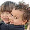 Two little boys hugging 