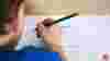 Boy carefully following lines to learn to write