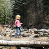 A father and daughter enjoy a relaxing walk in the woods