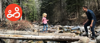 A father and daughter enjoy a relaxing walk in the woods