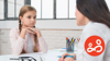 A parent support worker advises a young girl during a counselling session