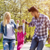 Parents walking with child in the park