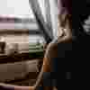Lady sitting by window meditating
