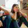Couple looking stressed surrounded by moving boxes